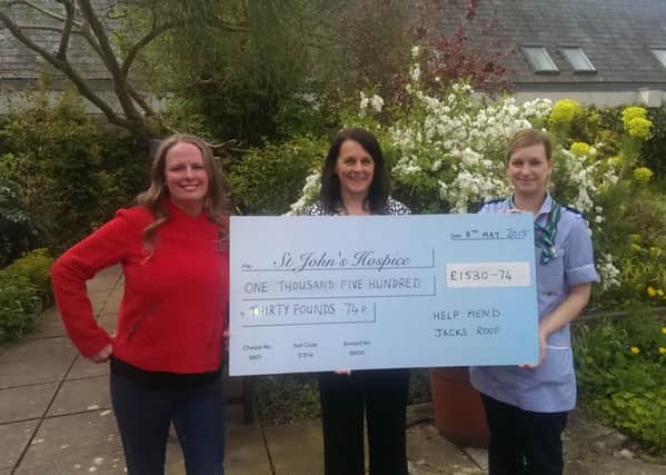 From left: Clare Huddleston, who set up the Facebook page Help Mend Jack's Roof, community fundraiser Karen Crossley and nurse Alice Brewer. Clare presented a cheque for £1530 to St John's Hospice from the remainder of funds raised by generous donations from members of the public to fix an OAP's roof after he was conned out of £10,000 by rogue roofers.