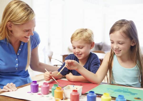 A Generic Photo of a mother painting with children. See PA Feature FAMILY Digital Detox. Picture credit should read: PA Photo/thinkstockphotos. WARNING: This picture must only be used to accompany PA Feature FAMILY Digital Detox.