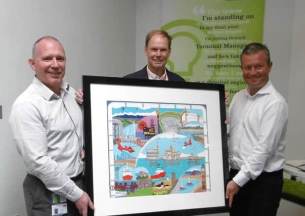 Graham Sheedy, Operations Manager for the Morecambe Hub at Centrica Energy, artist Chas Jacobs and Andy Bevington, UK Operated Assets Director at Centrica Energy.