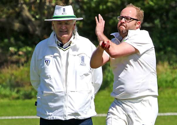Westgate's bowler Garry Tattersall in action against Warton. Picture: Tony North.