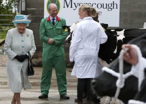 Queen Elizabeth II inspects cattle at Myerscough College during her visit to Lancaster, after she arrived at the historic city by royal train. PRESS ASSOCIATION Photo. Picture date: Friday May 29, 2015. See PA story ROYAL Lancaster. Photo credit should read: Andrew Yates/PA Wire
