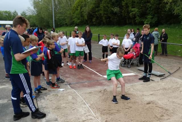 Lancaster and Heysham Primary School Sports Festival. Leaders measure some fantastic jumps in the athletics