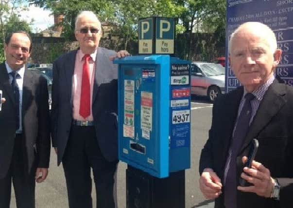 John Wheeley from RingGo, Coun Abbott Bryning, Lancaster City Council Cabinet member for parking and Jerry North, Manager of St Nicholas Arcade Shopping Centre, hail the arrival of the district's new cashless car parking scheme.