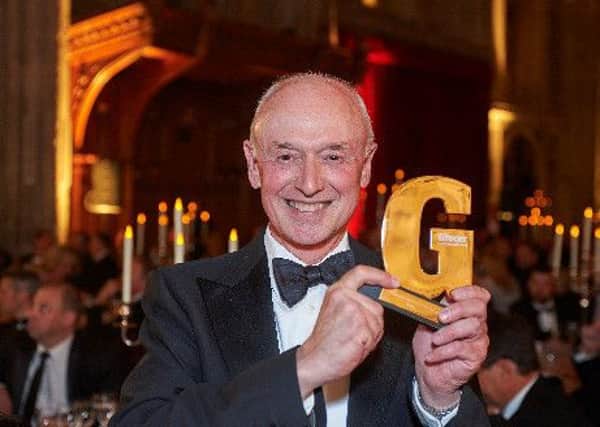 Booths Chairman Edwin Booth with the Grocer Gold Award for Best Independent Retailer.