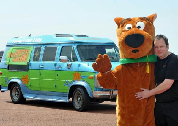 Picture by Julian Brown 15/06/15

Mark Simpson pictured with his Scooby Doo van and Scooby Doo in Morecambe.