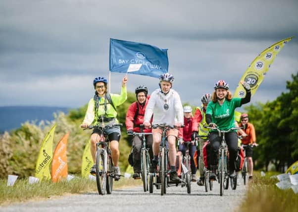Celebrations as riders arrive at Glasson Dock, Lancaster after completing the Bay Cycle Way.'  Pictures by Steven Barber.