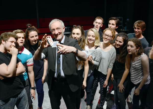 Magician David Lancaster with members of The Dukes Young Company.
