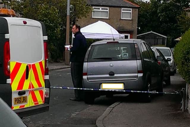 A crime scene tent at the scene of the incident in Heysham village.