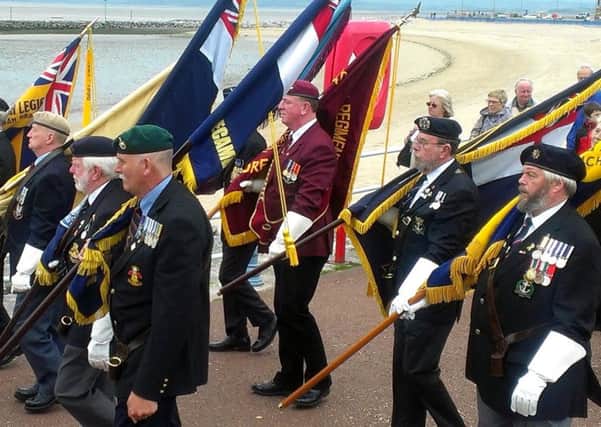 Standard bearers from the Morecambe and District United Services Association on their march from the clock tower to Morecambe Arena on Sunday to mark Armed Forces Day.