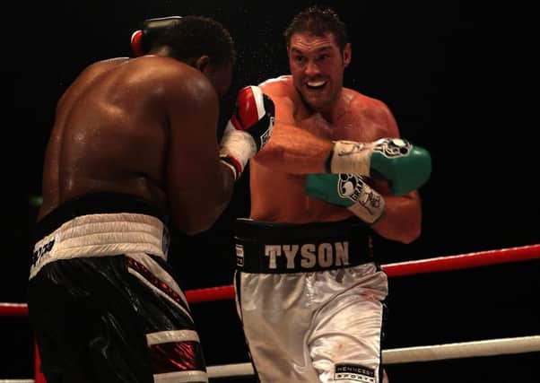 Hughie Fury trained Tyson Fury (right) for some of his biggest bouts, including this British and Commonwealth Title win over Dereck Chisora in 2011. Nick Potts/PA Wire.