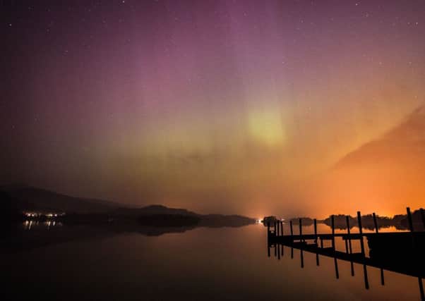 The aurora borealis, or the Northern Lights as they are commonly known, over Derwent water near Keswick in the Lake District. PRESS ASSOCIATION Photo. Picture date: Wednesday March 18, 2015. See PA story ENVIRONMENT Aurora. Photo credit should read: Owen Humphreys/PA Wire