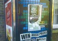 Tic Tac poster put in BT phone box to obscure view