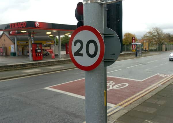 The new 20 mile per hour speed limit signs on Regent Road.