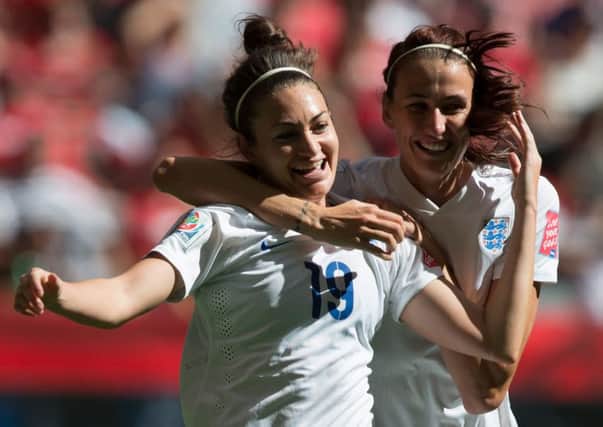 England's Jodie Taylor, left, and Jill Scott celebrate Taylor's goal against Canada.