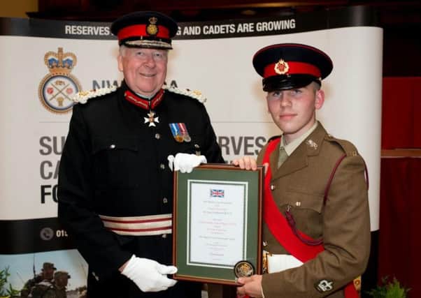 Lord Shuttleworth KCVO, Lord-Lieutenant of Lancashire hands over the award to Cadet Company Sergeant Major Wade.