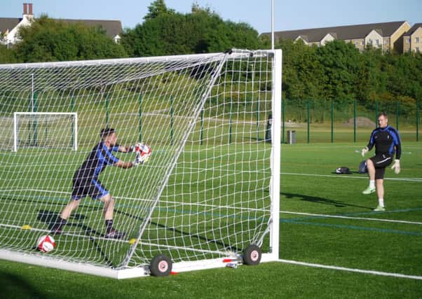 Lancaster City pre-season training June 30 2015. Mike Hale puts fellow goalkeeper Michael Donlon through his paces. Picture: Adam Lord