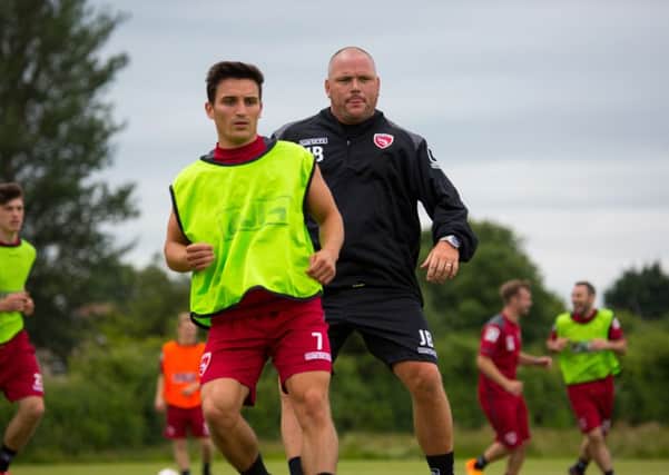 Jim Bentley gets stuck into pre-season training and keeps an eye on wanted man Jack Redshaw. Picture: Matt Rushton