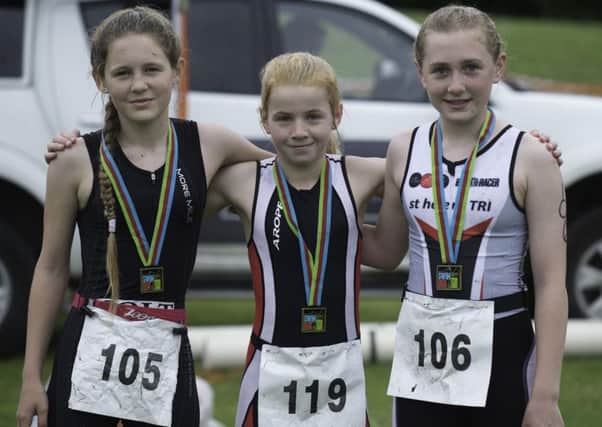 Tristar 2 medalists at the Wirral Triathlon, from left, City of Lancaster Triathlons Sasha Oldham (gold), Larissa Hannam (bronze) and Harriet King (silver)