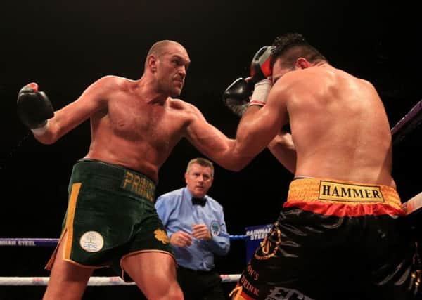 Tyson Fury on his way to victory over Christian Hammer. Picture: PA Wire