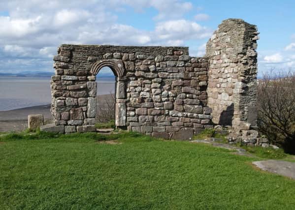 The remains of a medieval chapel on a cliff edge on National Trust Land, Morecambe Bay.