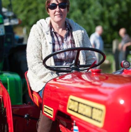 Anthony Farran 15.08.2015 The Winmarleigh Tractor Run, Pictured; Mrs McWhirler on her and her husbands shared 1963 david Brown 880 tractor.