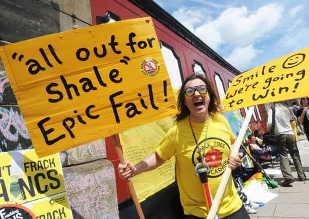 Anti-fracking protesters celebrate outside Lancashire County Hall after Cuadrilla's fracking application is refused