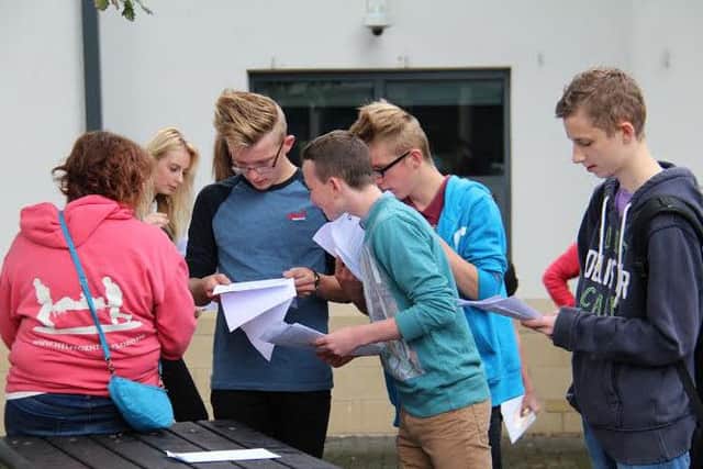 Ripley pupils check their results.