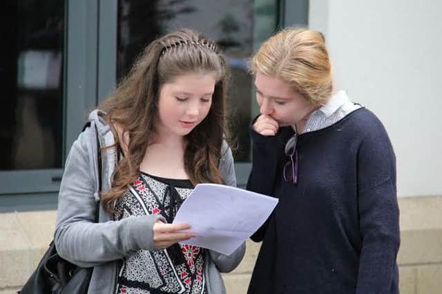 Ripley pupils check their results.