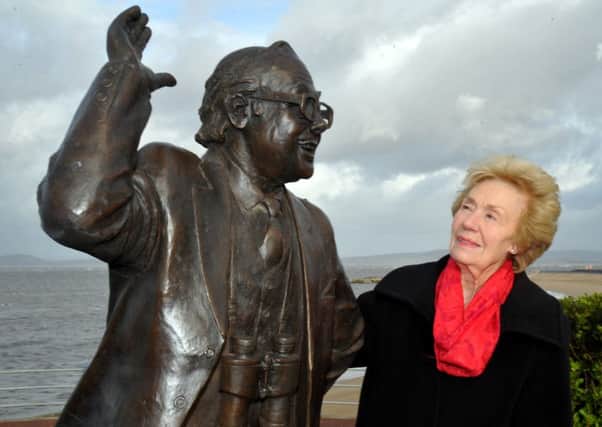 Eric Morecambe's widow Joan poses with the statue