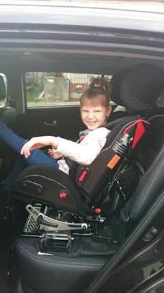 Maya Polak in her new car seat.