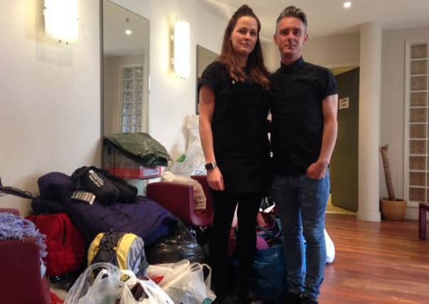Evonne Prior and Robert Smith with the growing pile of items.