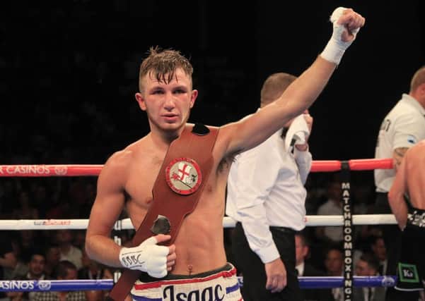 Isaac Lowe gets his hands on the English title. Picture: Lawrence Lustig/Matchroom Boxing