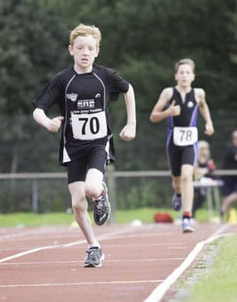 Rhys Ashton, 11, takes the lead in the Tristar 2 boys race to take gold.
