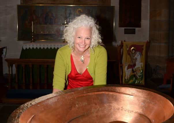 Hilli McManus and the singing bowl at Lancaster Priory.