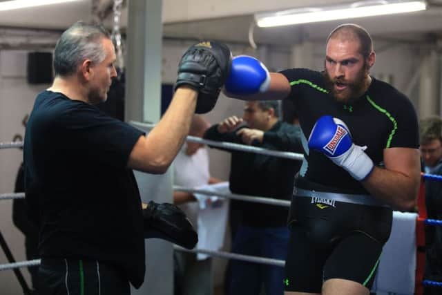 Peter Fury puts Tyson Fury through his paces. Picture: Nick Potts/PA Wire