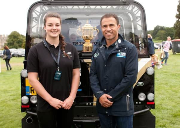 Sally Stott with Jason Robinson and the World Cup trophy. Picture: onEdition