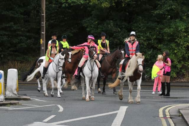 Photo Neil Cross
"Naked" horse riders who are parading through Morecambe for the Slow Down for My Horse Campaign.