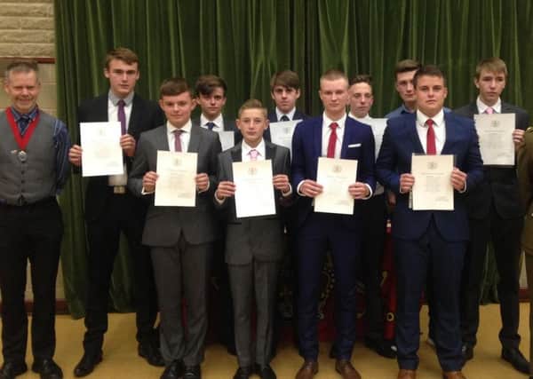 Mayor of Lancaster Jon Barry with the young men who have swore the oath to the Queen and coutry at the enlistment ceremony, with Majro Marc Steventon, MBE.