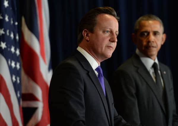 British Prime Minister David Cameron (left) holds a press conference with US President Barack Obama. Photo: Stefan Rousseau/PA Wire
