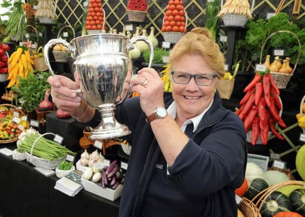 Margaret Robinson, from W Robinson & Son, with the Best in Show trophy for horticultural trade displays at  Harrogate Autumn Flower Show