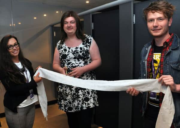 LUSU Vice-Presidents Katie Capstick, Anna Lee and Tom Stapleton in the new gender-neutral toilet at the Sugarhouse.