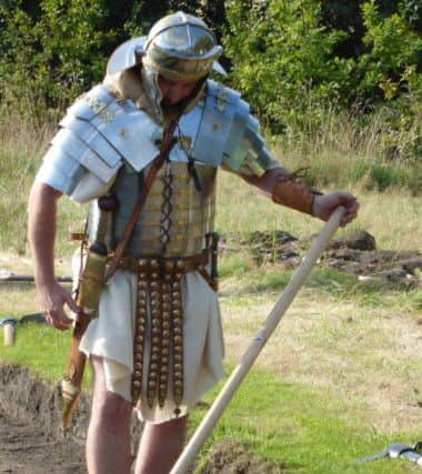 A Roman soldier in action at Lancaster's big Roman dig.