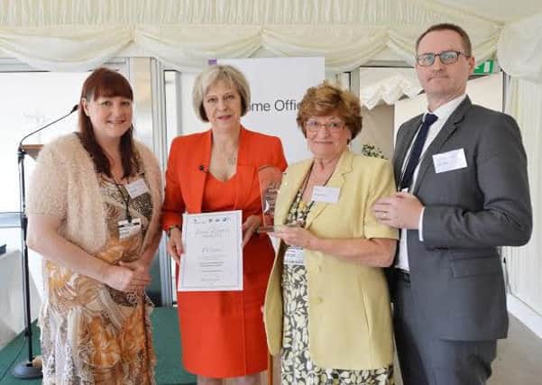 Peter Grices daughter, Jane, wife Vicky and son Ivan with Theresa May.