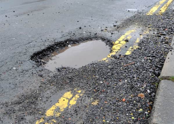 Potholes causing danger to motorists and cyclists