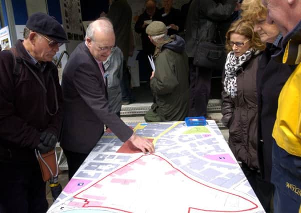 Steve Bryson from British Land (second left) talks to members of the public at the public consultation for Lancaster Canal Corridor by British Land in Market Square in 2013.