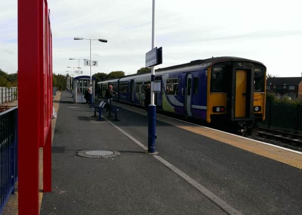 A train pulls in at Morecambe train station platform. The ticket office is currently shut whilst repairs are carried out.