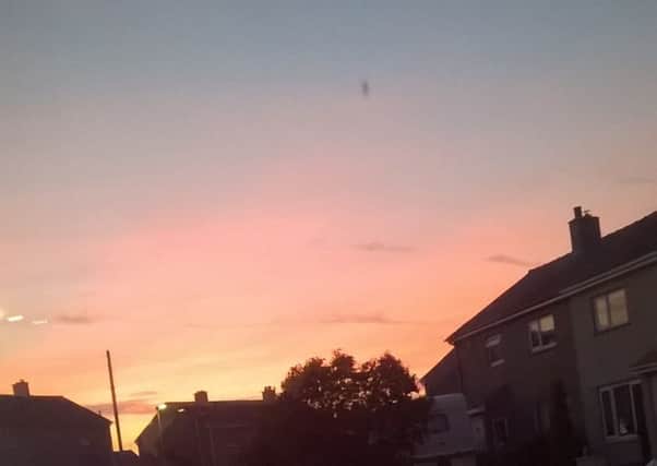 Mysterious lights in the sky (on the left of the picture) captured on a picture taken by reader Dianne Croskell.
