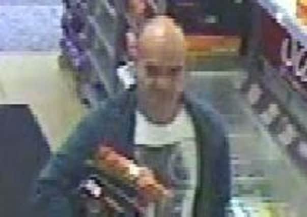 Police want to speak to this man in connection with the theft of a purse.
