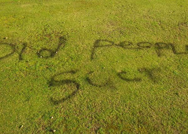 Graffiti sprayed on the bowling green at Regent Park in Morecambe.