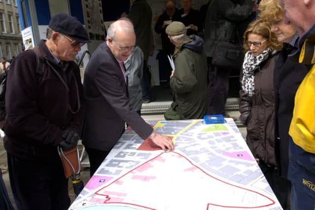 Steve Bryson from British Land (second left) talks to members of the public at the public consultation for the plans in 2013.